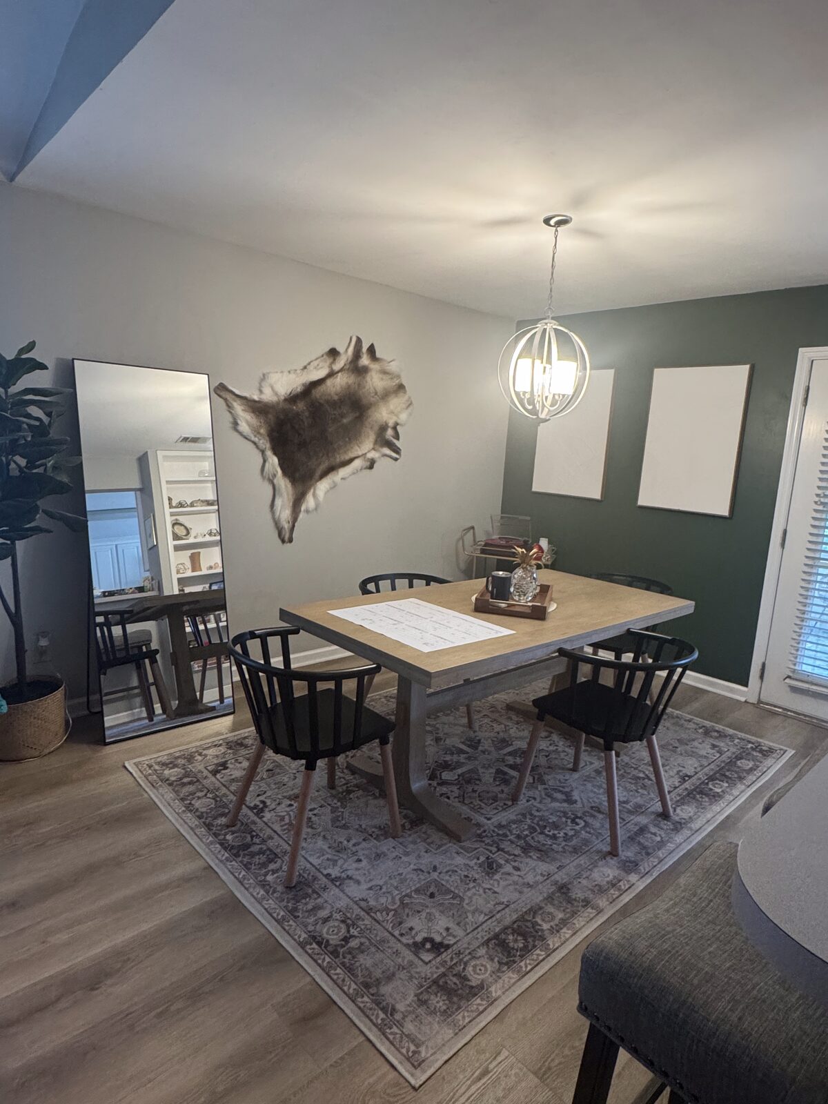 A styled short-term rental dining area, tidy and guest-ready between Airbnb stays.
